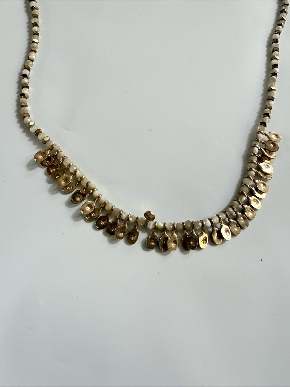 Gold and White Beaded Necklace with Gold Disc Charms
